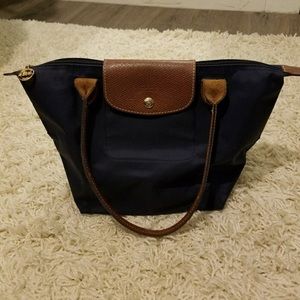 Small navy Le Pliage Longchamp bag w/ long handles